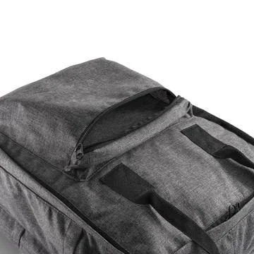 Top view of a grey backpack with an open additional pocket for various items. Stock Photos