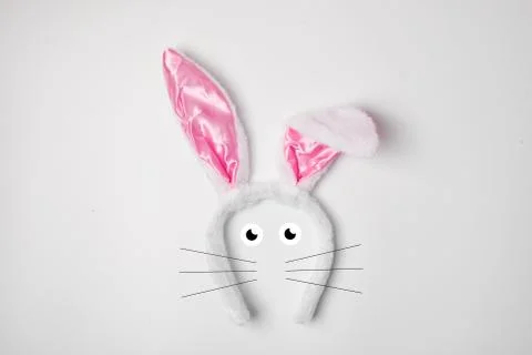 Top view of grey rabbit ears on white background easter minimal blogger conce Stock Photos