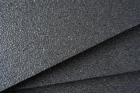 Top view of grey thermal insulation styrofoam sheets stacked on top of each.. Stock Photos