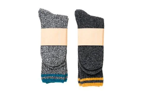 Top view of grey woolen winter socks on white background Stock Photos