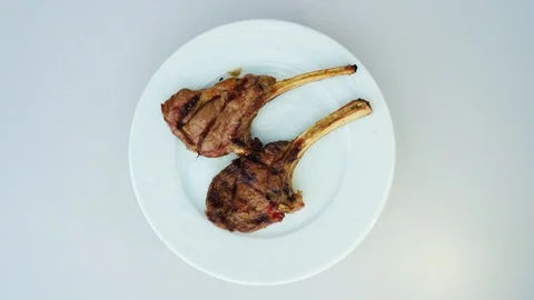 Top view, grilled lamb ribs like meat dish for lunch at a restaurant in the r Stock Footage 121528503