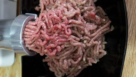 Top view of grinding of minced meat and onion Stock Footage 143998504