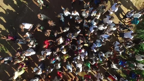 Top view of a group of African students watching the drone Stock Footage 158804110