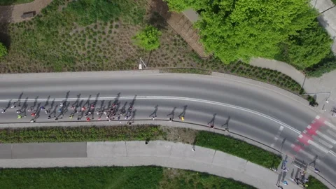 Top view of a group of runners running during the Krakow Marathon. Aerial shot Stock Footage 272675732