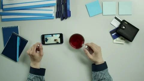 Top view of guy watching a video about himself Stock Footage 79997185