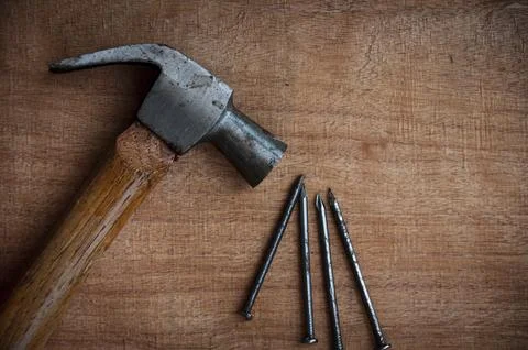 Top view of hammer with nails. Copy space and labor day concept. Stock Photos