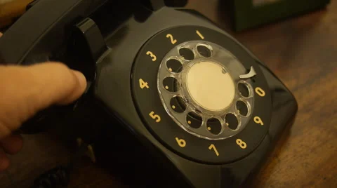 Top view hand dialing a number on old telephone Stock Footage 56139124