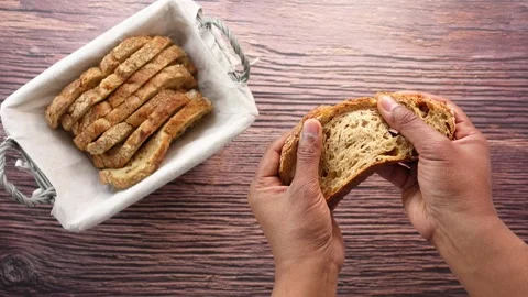 Top view of hand holding a slice of whole meal bread 스톡 동영상 272718763