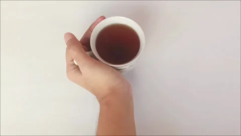 Top View Hand Holding White Ceramic Cup of Black Coffee Stock Footage 341649011