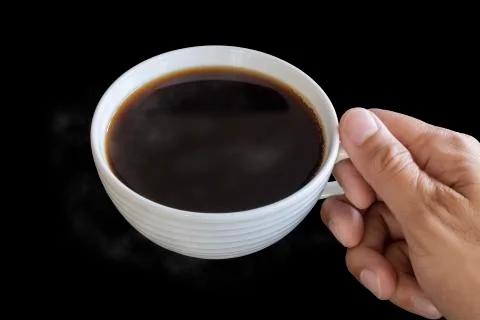 Top view hand man hold the white coffee cup wiht hot black coffee in side. Sa Stock Photos