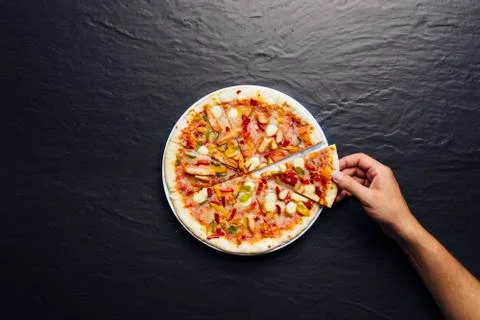 Top view of hand take homemade pizza 스톡 사진