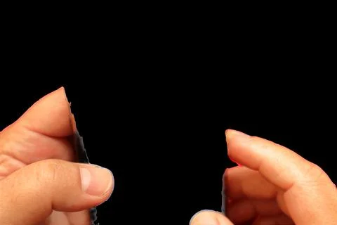 Top view of hand touching smartphone on France government site against red color Stock Photos