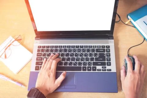 Top view Hand using laptop with blank screen on desk in home Stock Photos
