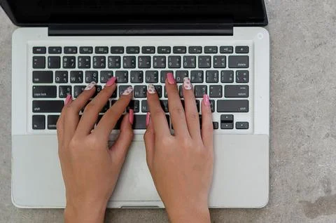 Top view hand woman using a laptop computer keyboard. concept technology bu.. Фото