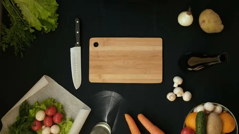 Top view handle shot of young woman cutting fresh vegetables on wooden board Stock Footage 128399477