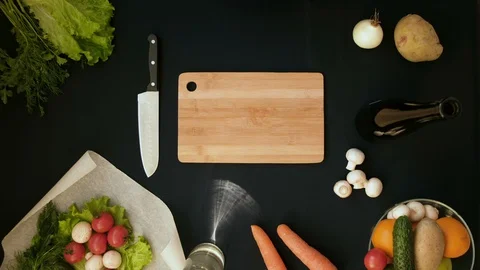 Top view handle shot of young woman cutting fresh vegetables on wooden board Stock Footage 128402642