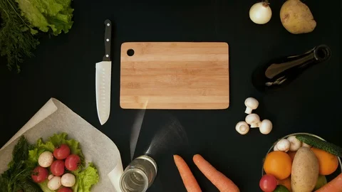 Top view handle shot of young woman cutting fresh vegetables on wooden board Stock Footage 128403620