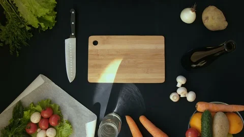 Top view handle shot of young woman cutting fresh vegetables on wooden board Stock Footage 128404131