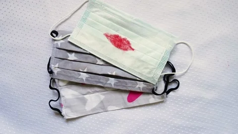 Top View of Handmade Protective Mask With Red Lipstick, Lips Imprint on Mask. Stock Footage 132649069