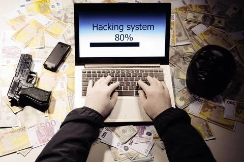 Top view on the hands of an attacker programmer hacking a data server from .. Stock Photos