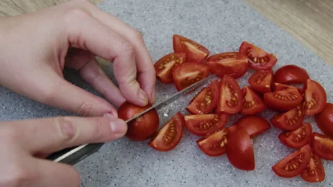 Top view of hands cutting tomatoes. Stock Footage 266419719