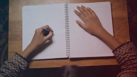 Top view of a hands drawing on paper Stock Footage 249069716