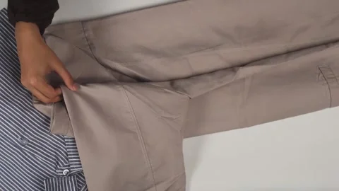 Top view of hands folding laundry clothes Stock Footage 276398331