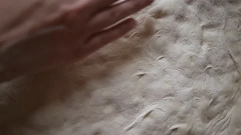Top view of hands gently stretching the pizza dough using fingertips Stock Footage 155995976