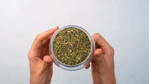 Top view of hands holding glass container with melissa tea. Two human hands Stock Footage 342976293