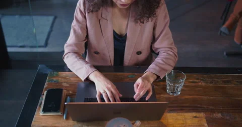 Top view hands of mixed race woman with curly hair typing messages using laptop Stock Footage 144223807