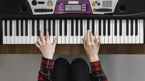Top view hands playing digital piano Stock Photos