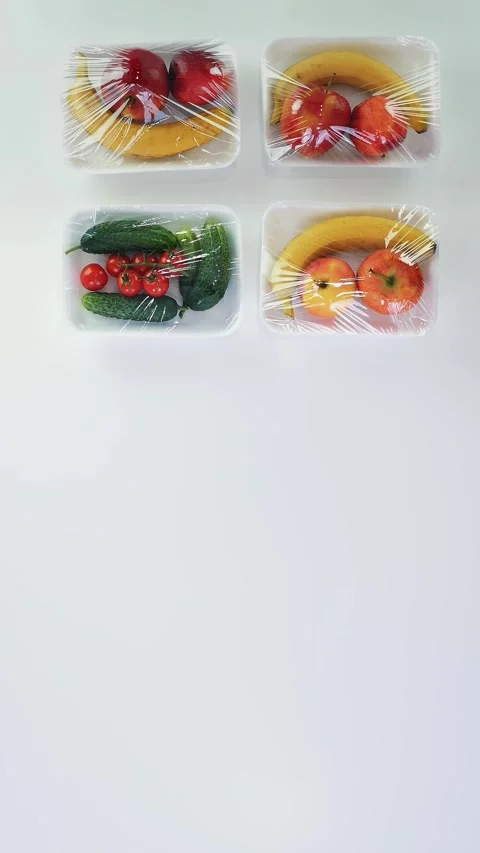 Top view, hands in protective gloves put vegetables, fruits packages next to Stock Footage 323007572