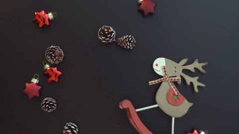 Top view hands put red branch on a dark table with Christmas decoration Stock Footage 70006962