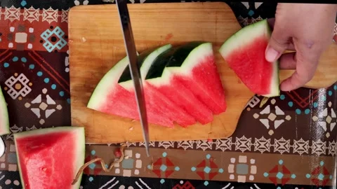 Top view of hands slicing fresh red watermelon. Video stock 329194839