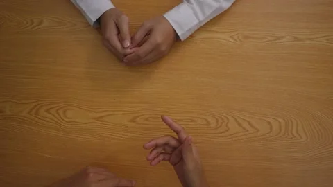 Top view of hands talking over business plans and taking payment Stock Footage 160559464