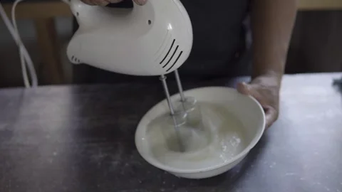 Top view of the hands of an unrecognizable baker beating egg whites Stock Footage 272496480