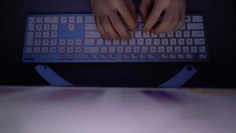 Top view of hands of unrecognizable man using computer typing on wireless Stock Footage 146316165