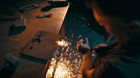 Top view of the hands of a worker cutting metal with an oxy-fuel torch. Stock Footage 225875343