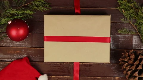 Top view hands wrapping christmas presents at wooden desk from above Stock Footage 68674609