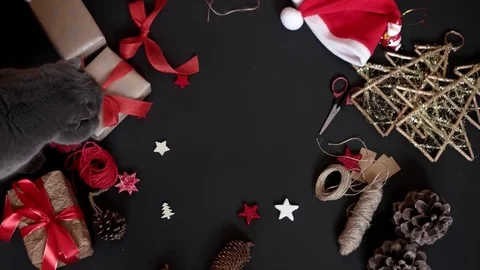 Top View Hands Wrapping Christmas Presents on Black Background From Above. Gift 库存影片 71795532