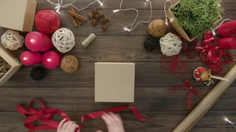 Top View Hands Wrapping Christmas Presents Stock Footage 81462054