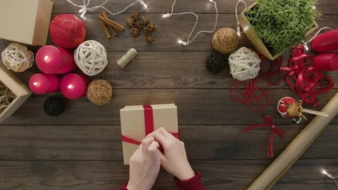 Top View Hands Wrapping Christmas Presents Stock Footage 81462461