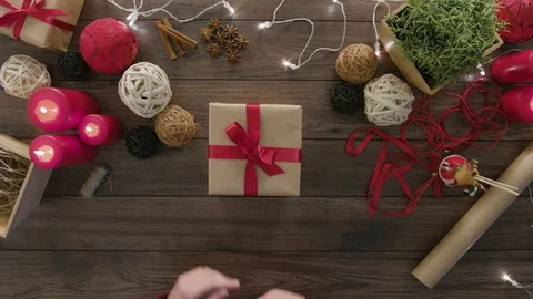 Top View Hands Wrapping Christmas Presents Stock Footage 81473281