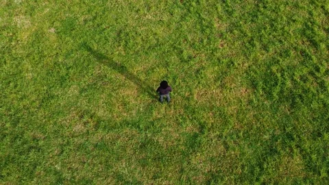 Top view a handsome man with a hat on his head admires the mountains, Stock Footage 210189178