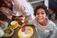 Top View Of A Happy Smiling Face Of Young Afro-American Girl At The Kitchen T Stock Photos