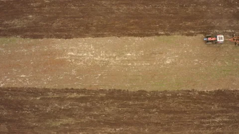 A top view of a harrow hoe in the field during the daytime Stock Footage 142198483