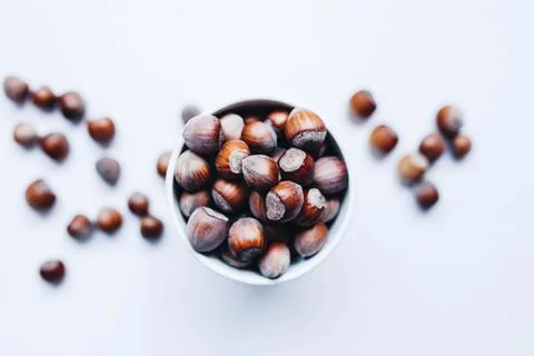 Top view of hazelnuts . Blurred hazelnuts in the background Stock Photos