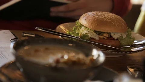 Top view of healthy breakfast in cafe. burger and granola Stock Footage 88155022