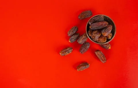 Top view  heap of date fruit isolated studio red background copy space Stock Photos