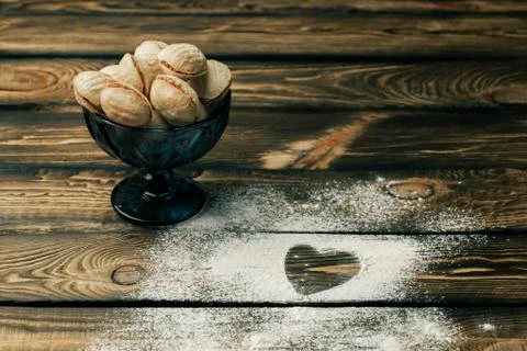 Top view of heart shape wheat flour with the letter love. baking nuts Stock Photos